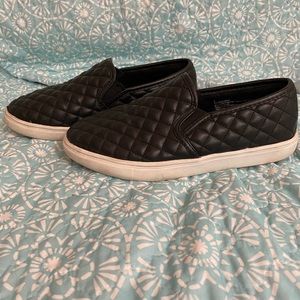 Black quilted slip on shoes